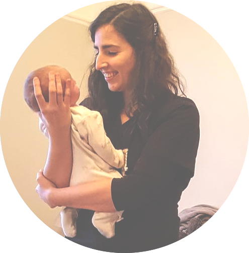 Holistic Tongue Tie Midwife holding and smiling at a baby